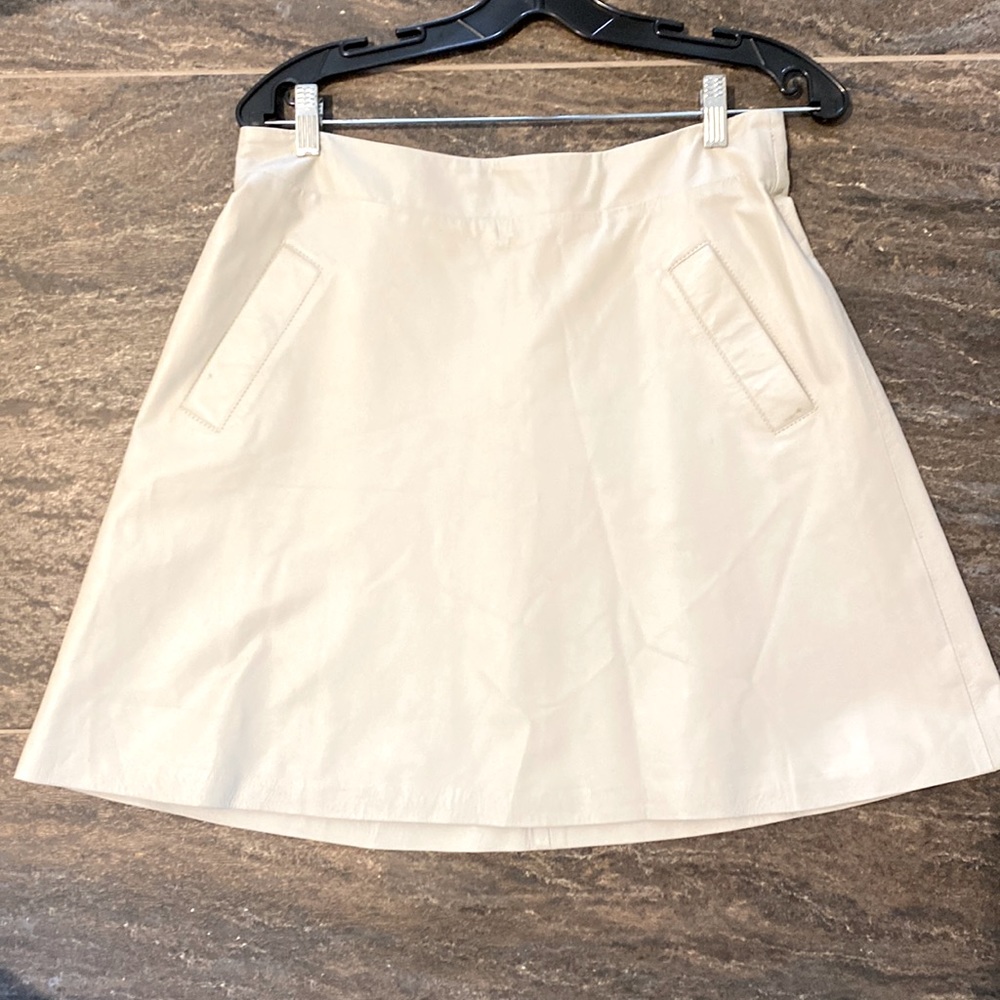 Cream colored leather A Line mini with pockets